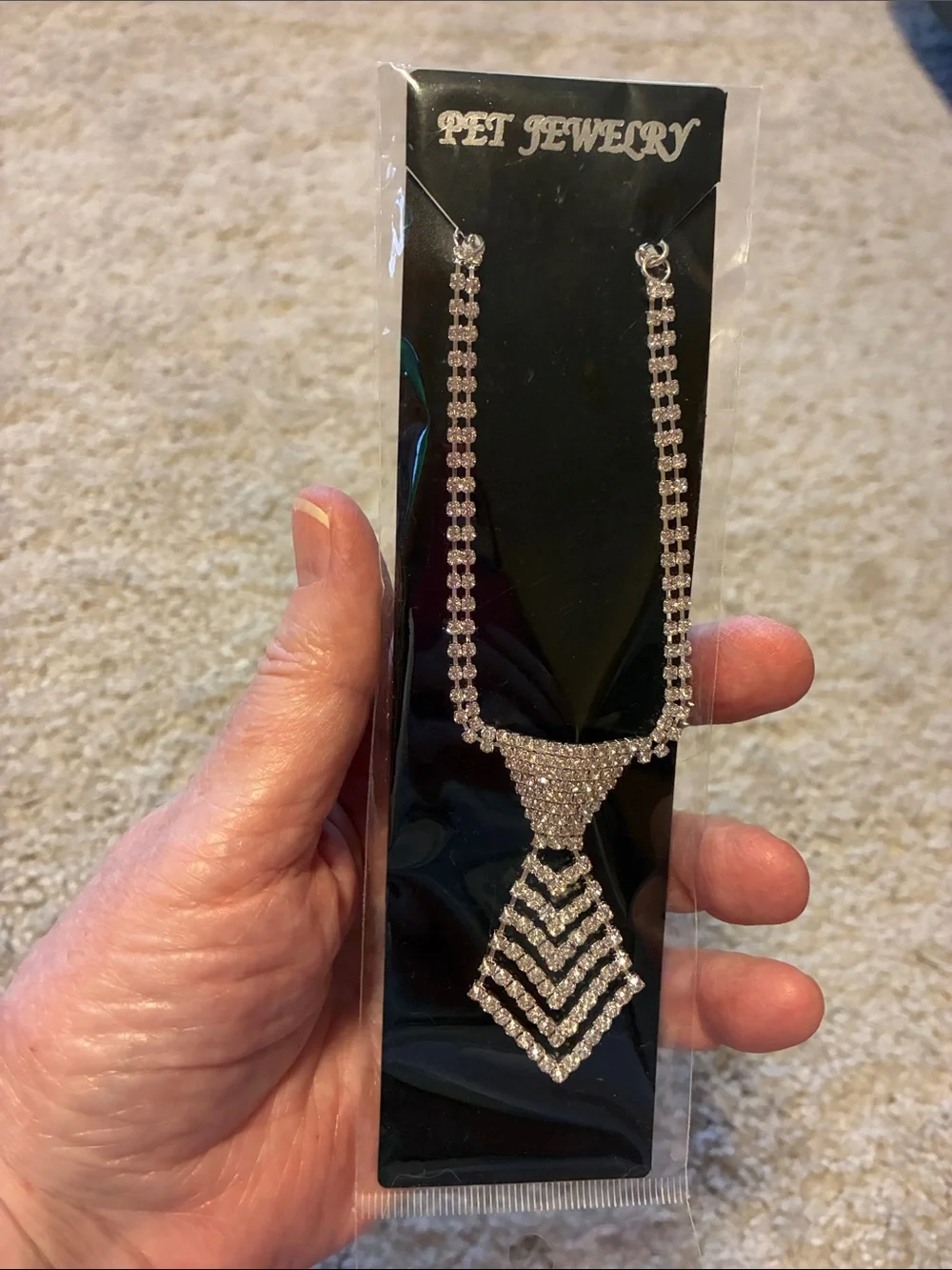 Dog Necklace is full of rhinestones. This necklace is a neck tie NWT